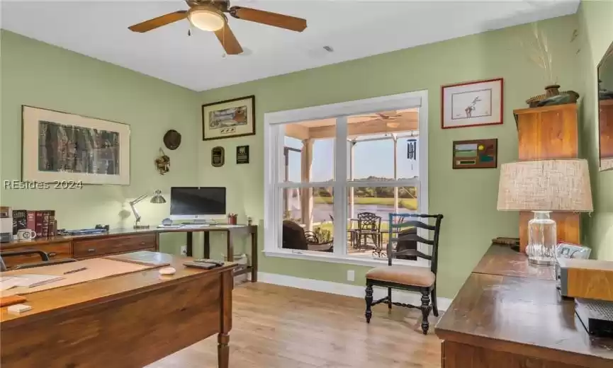 Office space featuring ceiling fan and light wood-type flooring