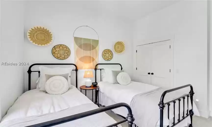 Carpeted Guest  bedroom 2 featuring ceiling fan