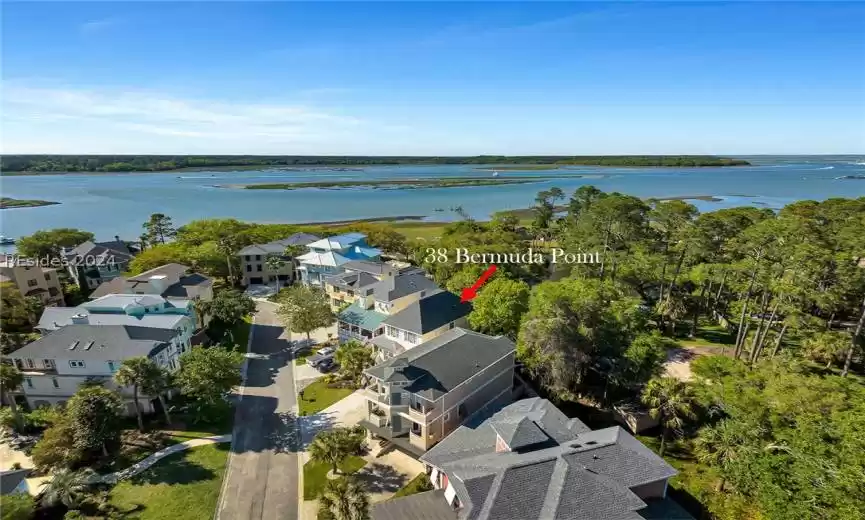 Birds eye view of property with a water view