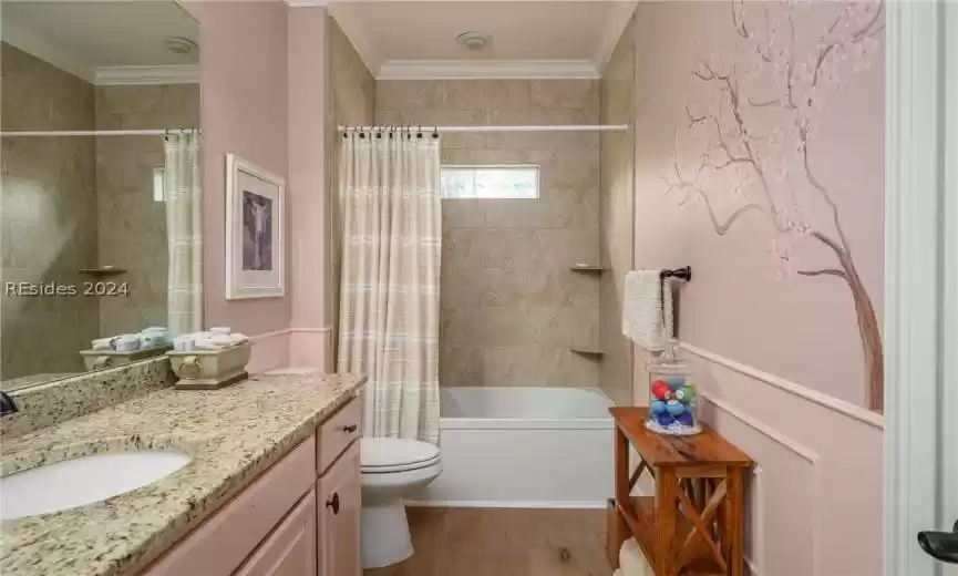 This main bath opens from the front guest bedroom as well as the hallway.