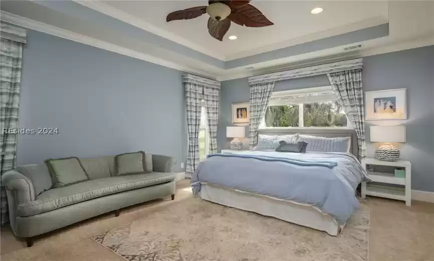 Tucked away for privacy and quiet, this spacious master suite with tray ceiling is a wonderful retreat!