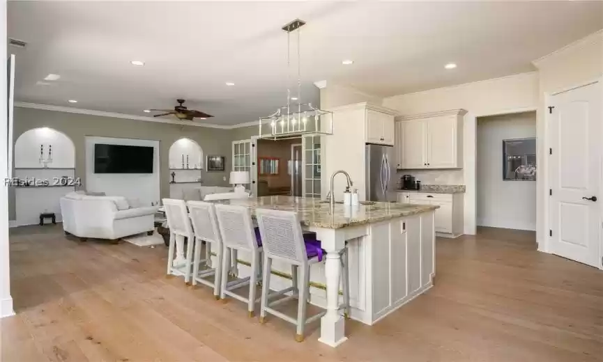 Custom kitchen design with stainless appliances including double ovens, 42