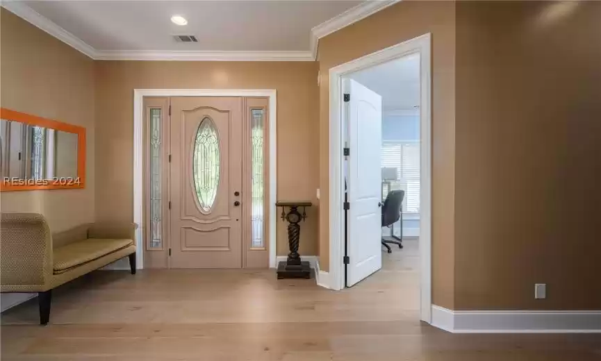 Foyer. Office/4th guest bedroom to the right. New hardwood floors in main areas.