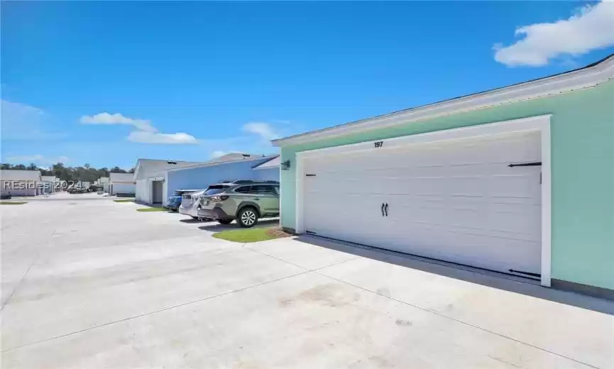 Rear entrance to cottage w/ guest parking space