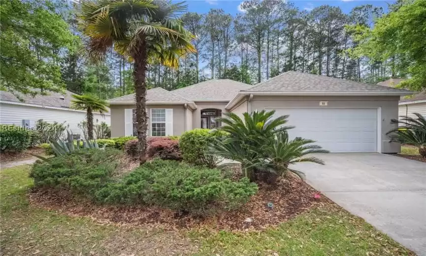 Single story home featuring a garage