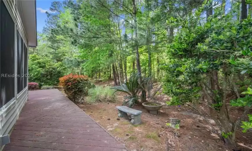 View of yard with a deck