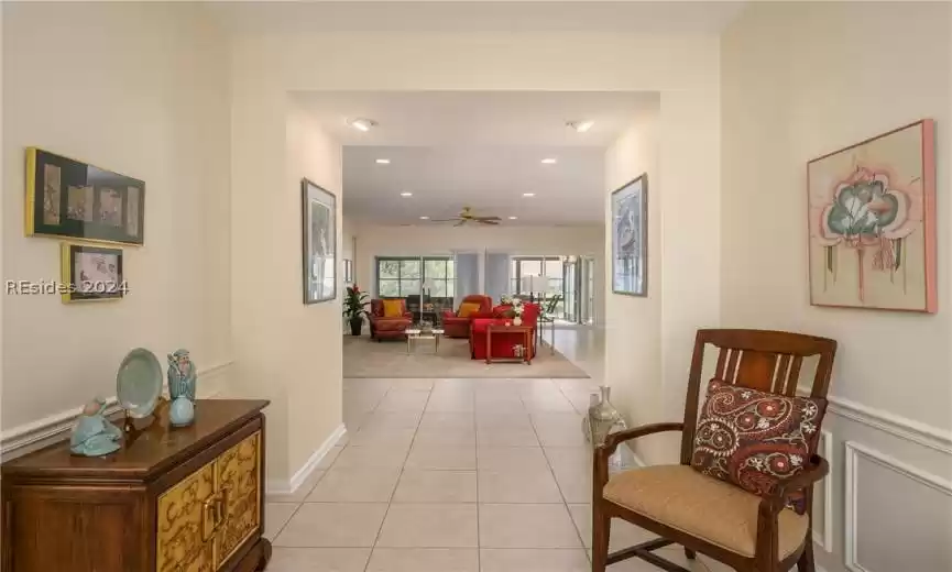 Hall featuring light tile floors