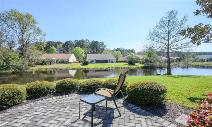 View of patio with a water view