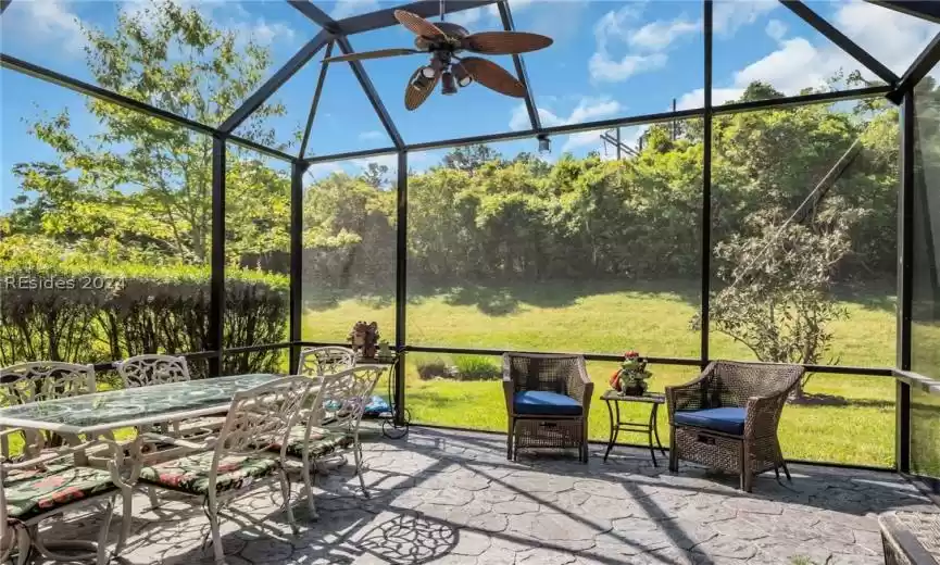 Screened Porch/Lanai featuring ceiling fan