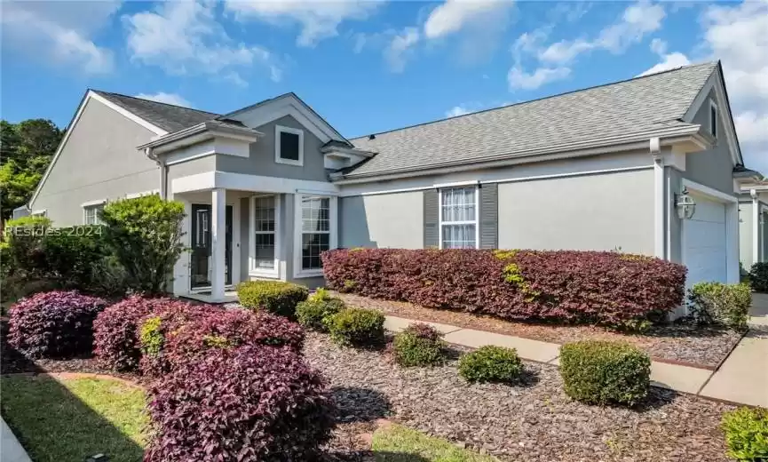 View of front of property with a garage