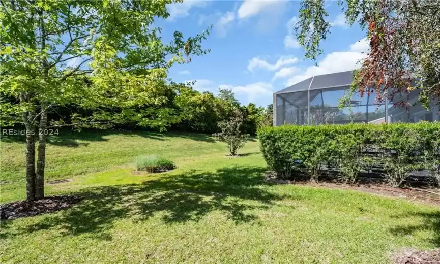 View of yard  featuring screened porch