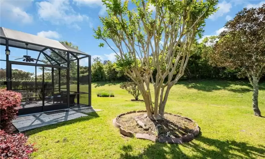 View of yard featuring screened porch
