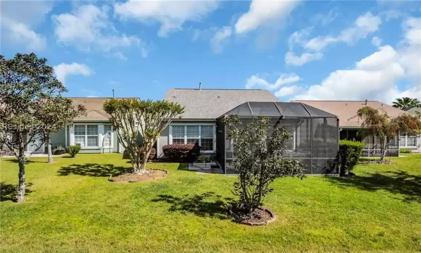 View of back of home with Screened Porch/Lanai
