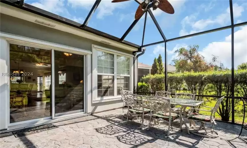 Screened Porch/Lanai featuring ceiling fan