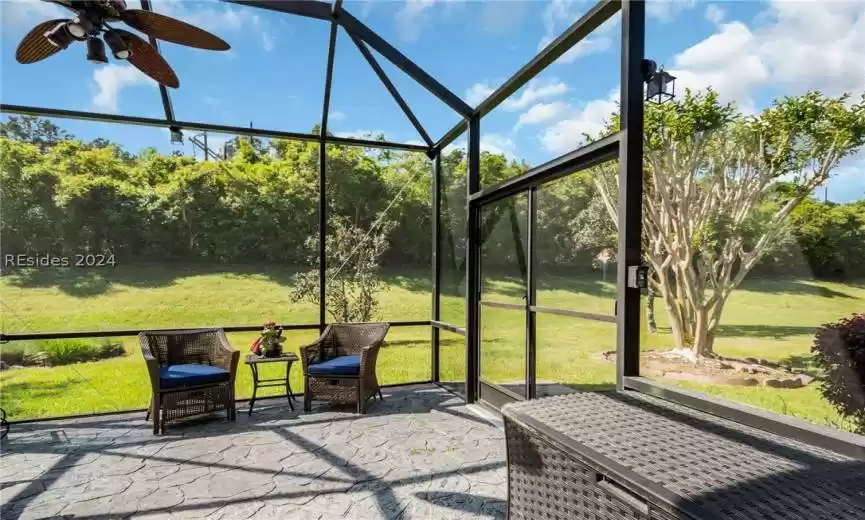Screened Porch/Lanai featuring ceiling fan