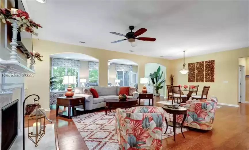 Wall of windows in this Carolina Room and Screened Lanai attached.