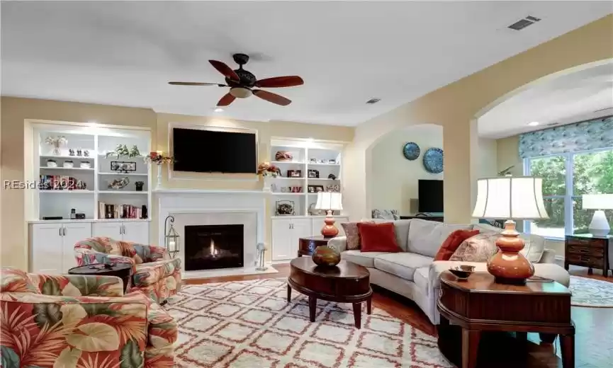 Arches and Architectural Details throughout. Gleaming Hardwood Floors in main area.