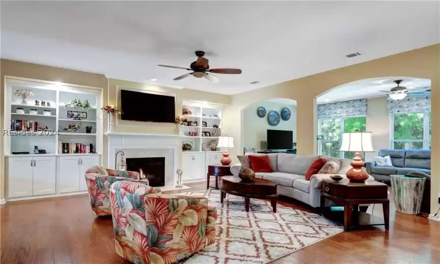 Custom Cabinetry and Lighting surrounding the Gas Fireplace.