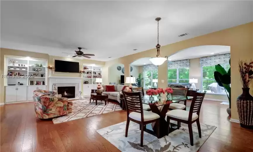 Gas Fireplace and Custom Built Ins in this Open Floor Plan w Great Room, Carolina Room and Kitchen.