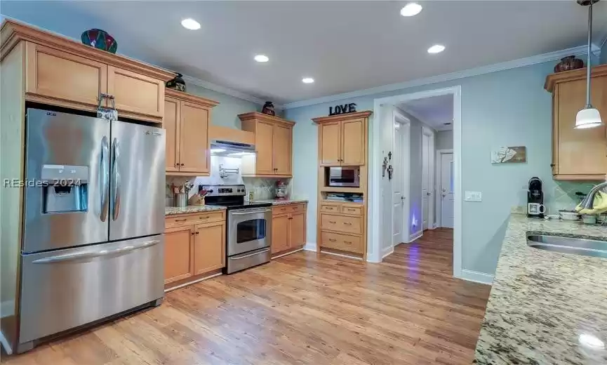 Kitchen to Powder Room, Laundry Room and Passage to Garage