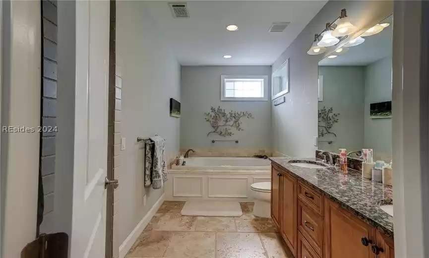 Primary Bath with Double Sinks, Jetted Tub and Tile Shower with Built-In Bench