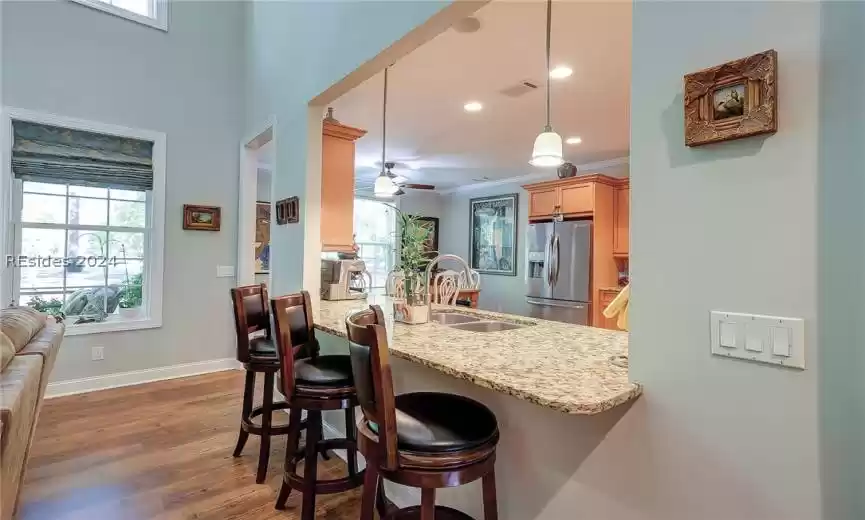 Eat-In Kitchen with Breakfast Bar, Granite Counters, Pendant and Recessed Lighting