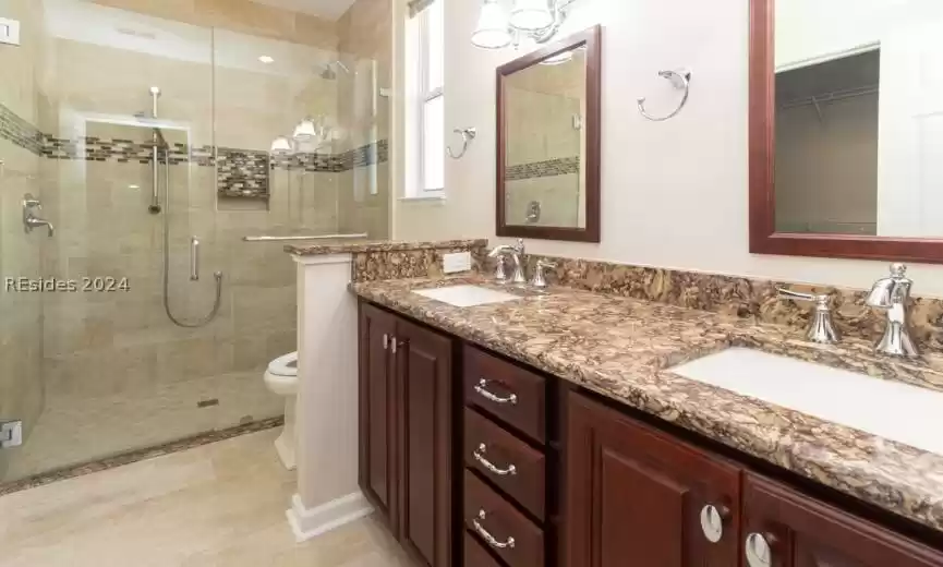 Large 2 sink vanity in updated master bath.