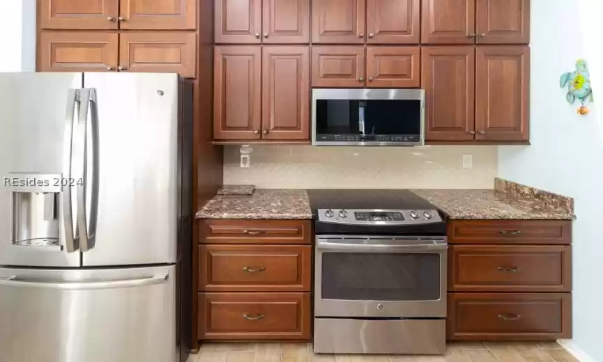 Updated kitchen with newer GE profile appliances.