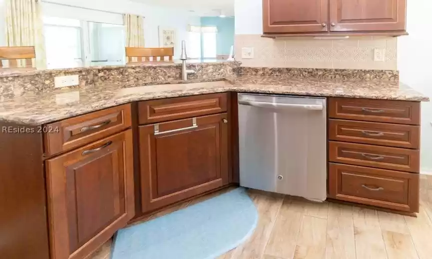 Granite countertops and stainless steel appliances.