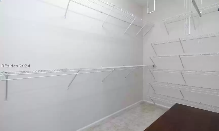 Huge master bedroom closet with extra shelving.