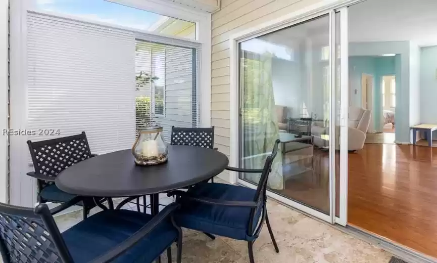 Conditioned Four Season's room with tile flooring.