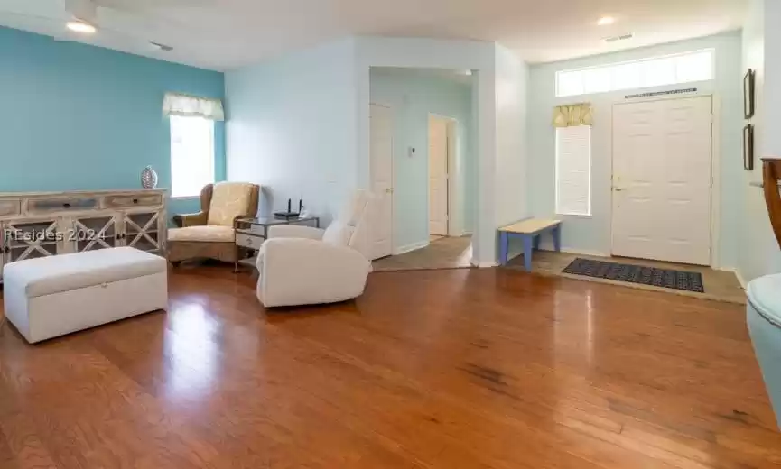 Foyer entrance showcasing the stained oak hardwood floors.