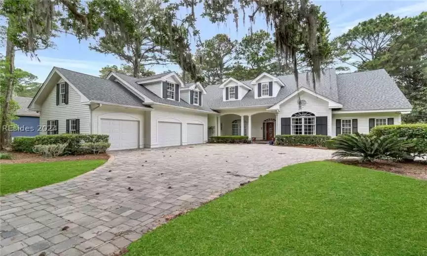 Large paver driveway to this 4 bedroom golf course view home in Belfair