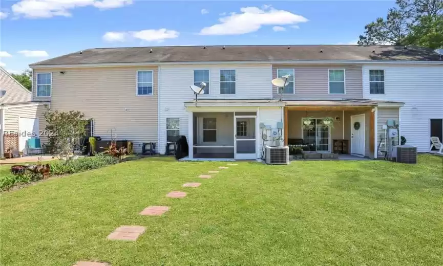 Rear of home with view of the screened porch