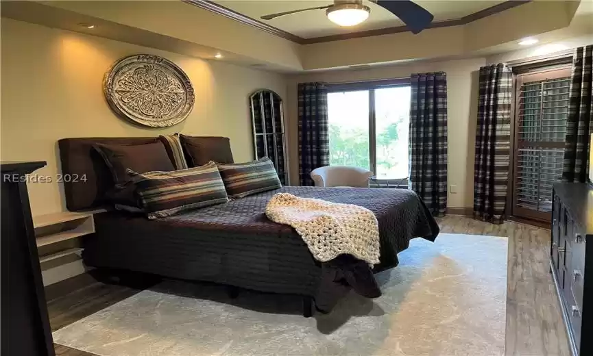 Hallway to bedroom/media room with 2nd screened balcony and ensuite bathroom.