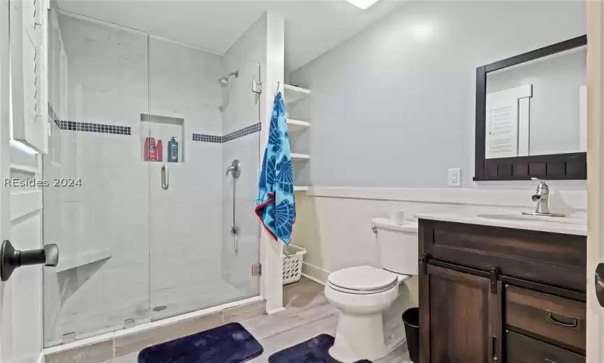 Guest Bathroom featuring vanity, and a walk-in shower