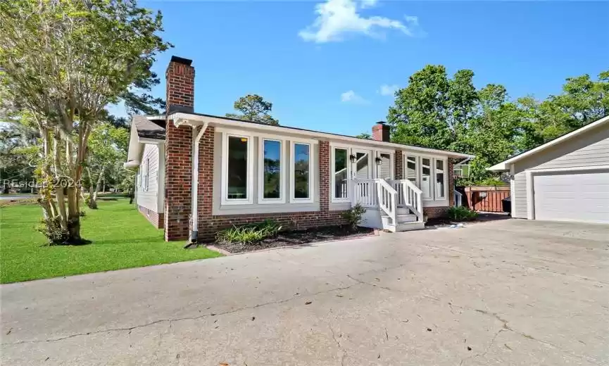 View of front of house with a front yard