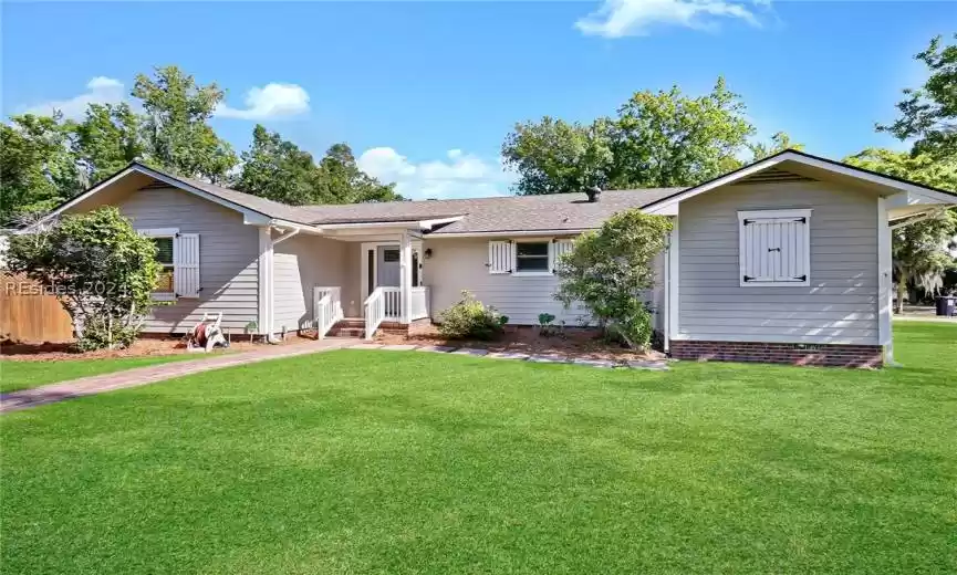 Single story home featuring a front yard