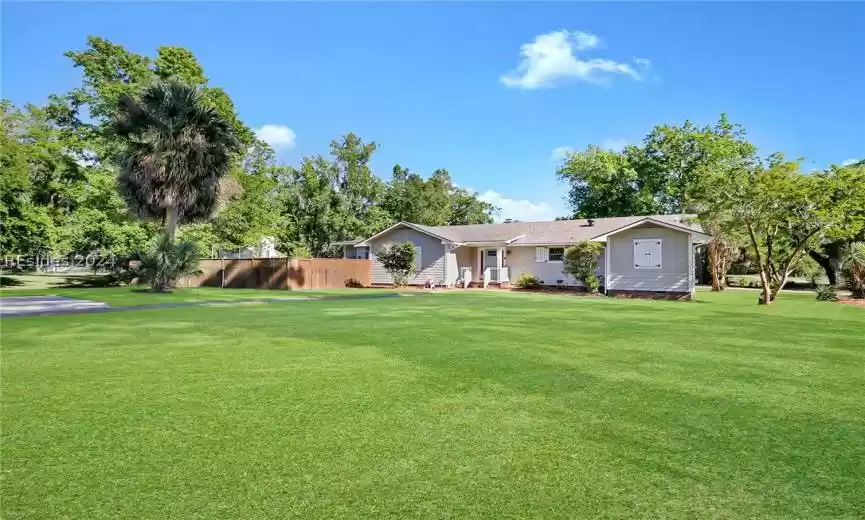 Ranch-style house with a front lawn