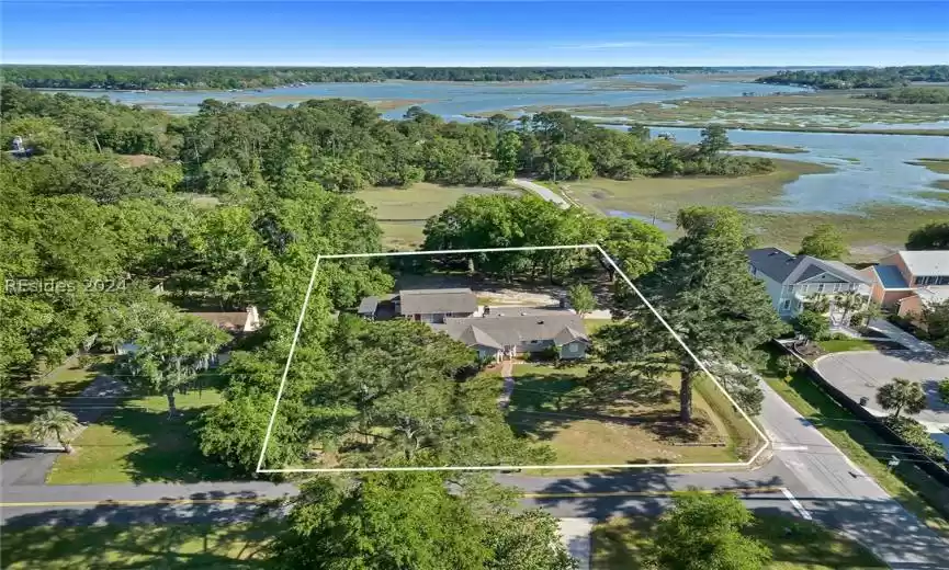 Birds eye view of property featuring a water view