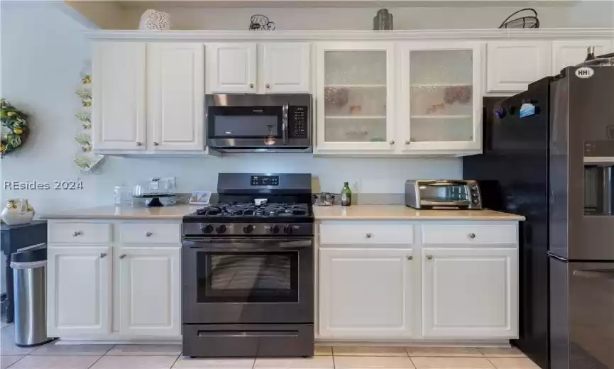 Kitchen with newer black stainless appliances