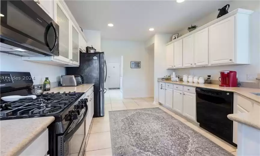 Kitchen that leads to the laundry room and garage