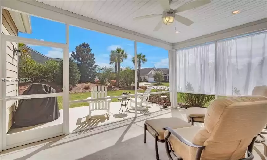 Screened porch with privacy curtains