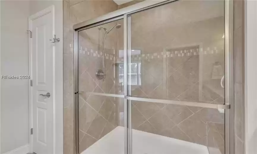 Tile shower with bench seat.