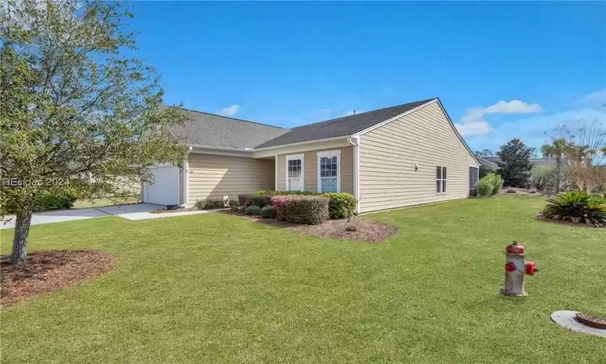 Corner lot offers added space and privacy!
