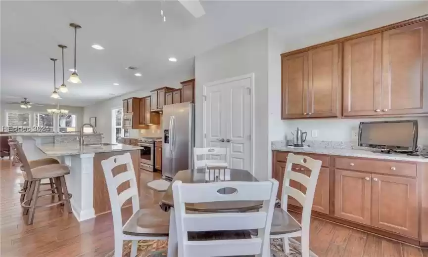 Upgraded and extended cabinets and countertops in kitchen/dining area for added storage