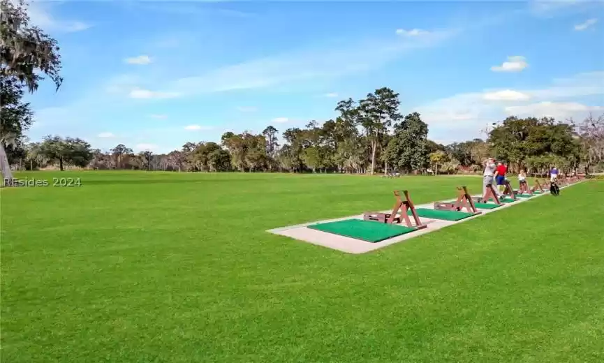 View of home's community with a yard