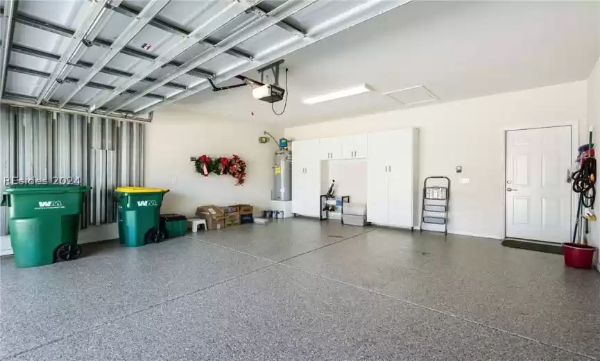 Finished 2-car Garage has new epoxy floor, new water heater, hurricane shutters and built-ins.