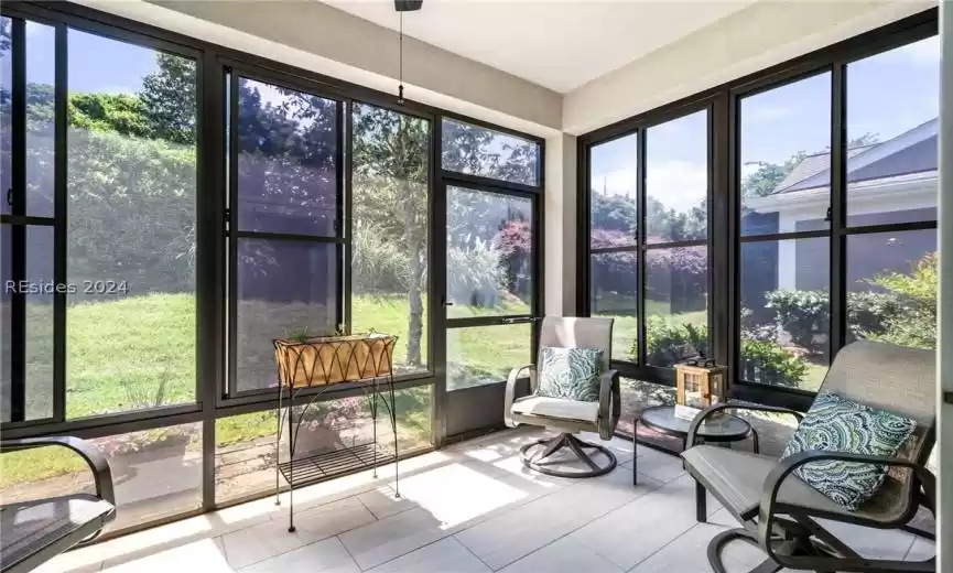 Sun room off living area has vinyl windows which gives owner nearly year around enjoyment. Ideal place for a morning cup of coffee.