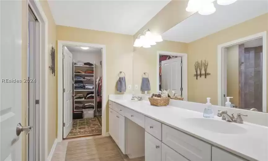 The primary bathroom complete with dual vanities.